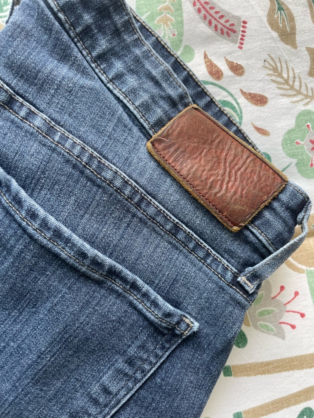 PAIGE blue denim jeans with brass button detail
